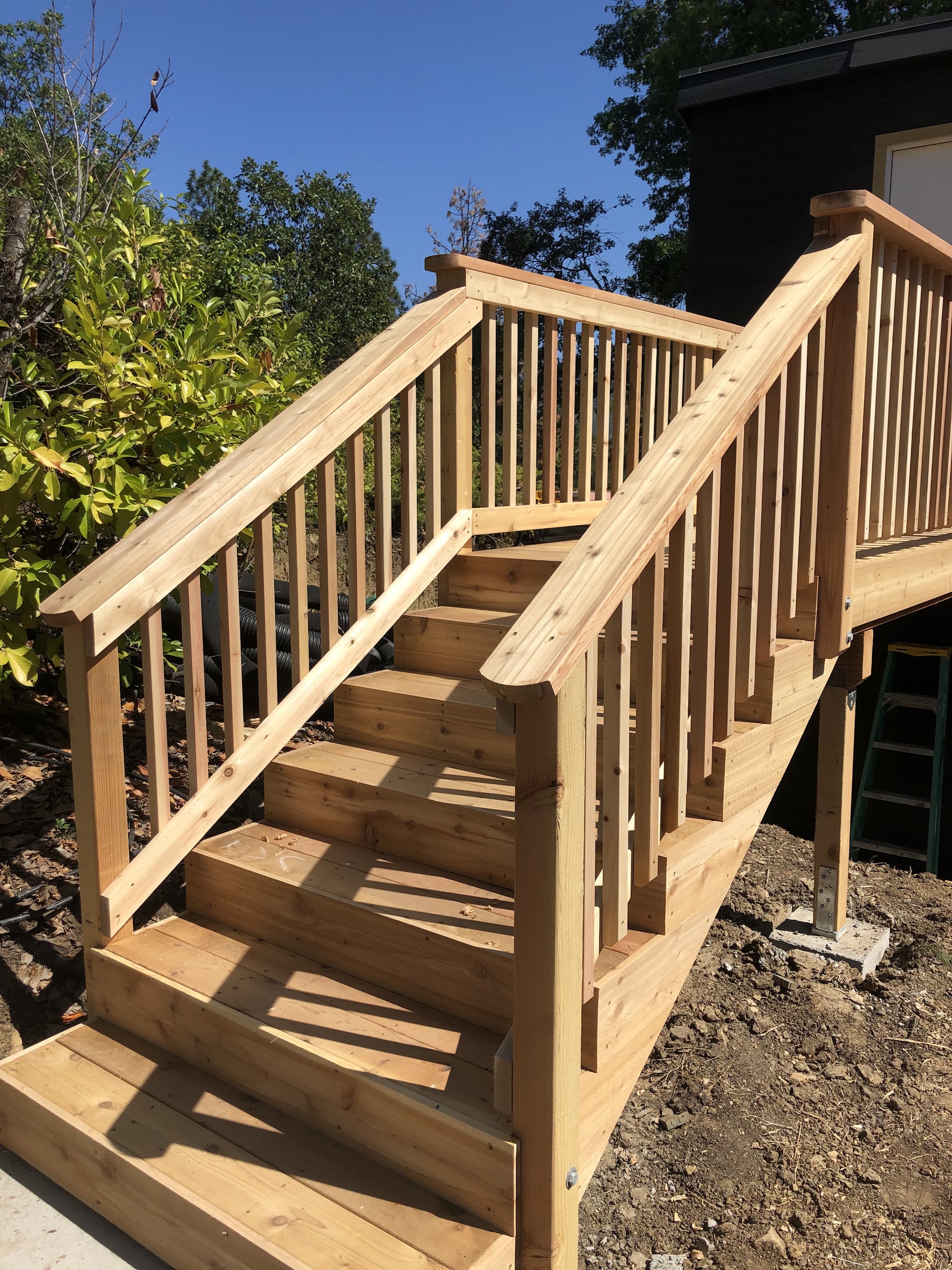 Cedar deck stairs and railing built by Warren Construction