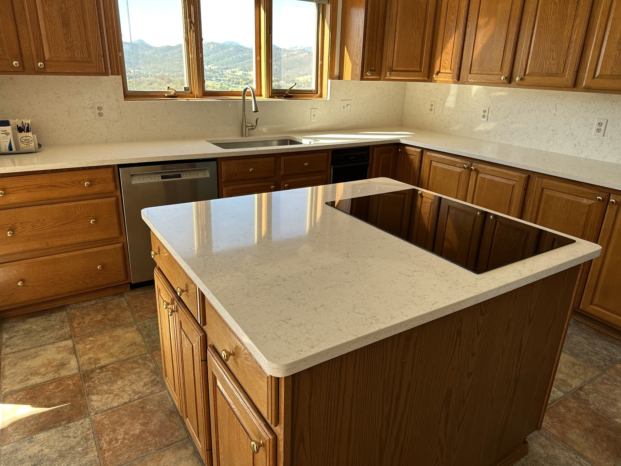 Kitchen island with quartz countertop and built-in induction cooktop